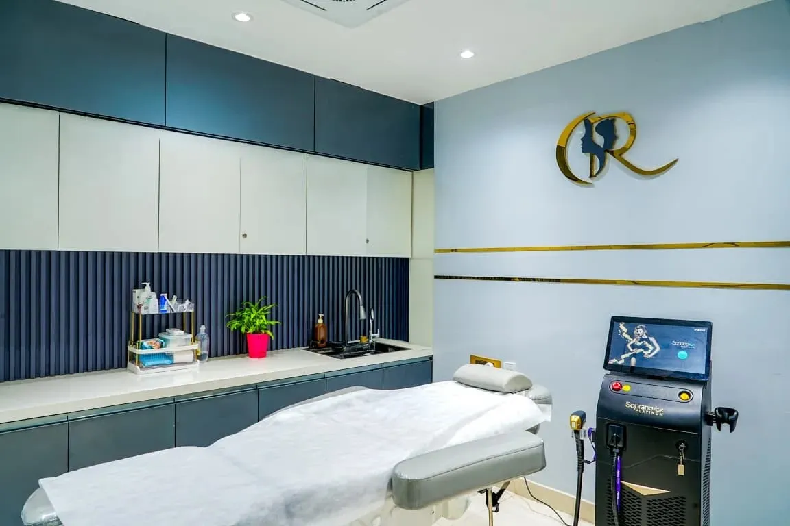 Advanced laser suite featuring the Alma Soprano Ice Platinum machine and an electric dermatology bed