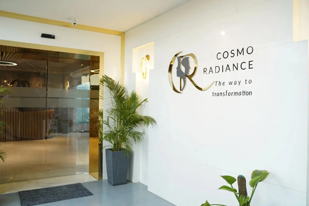 Main entrance of Cosmo Radiance clinic featuring Assa Abloy touch-free automatic glass doors