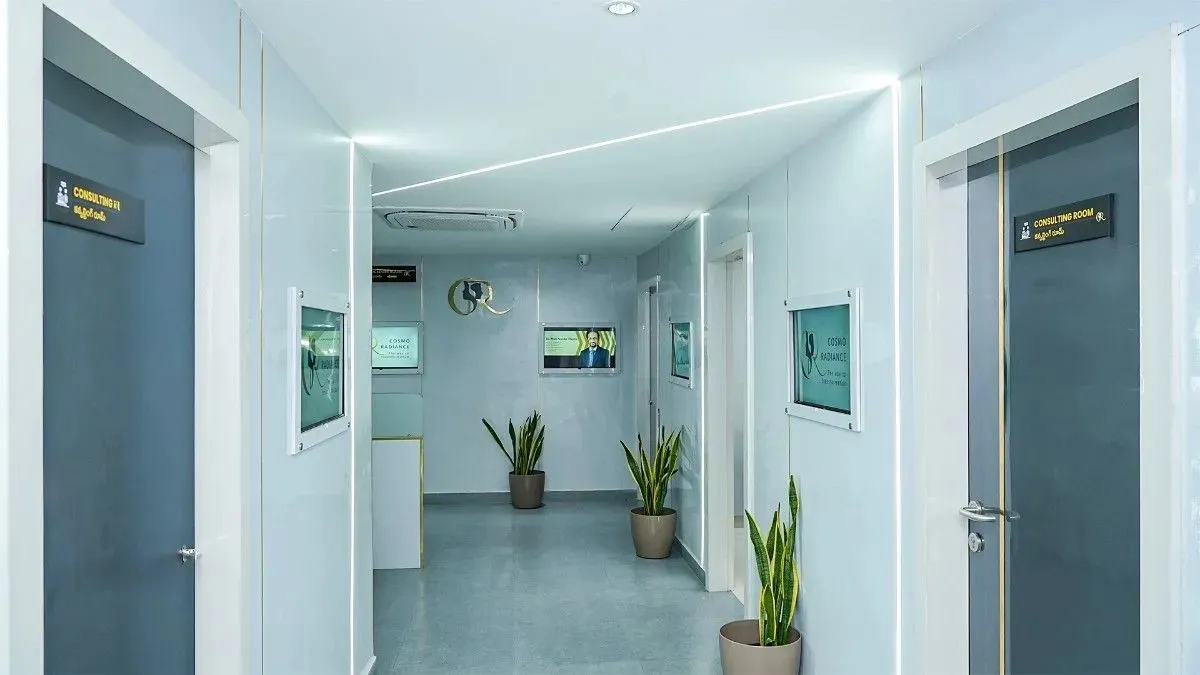Brightly lit modern clinic hallway adorned with indoor plants