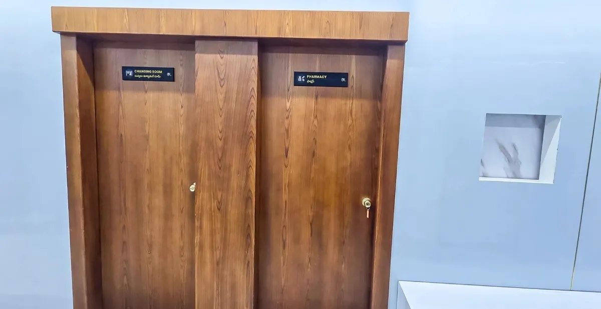 Licensed inpatient pharmacy counter and adjacent patient changing rooms