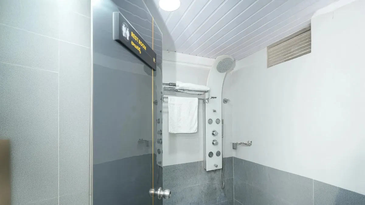 Private laser hygiene suite featuring a dedicated shower panel and changing area