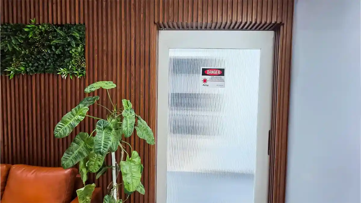 Secure restricted entry door with safety signage for the Laser and Procedure wing