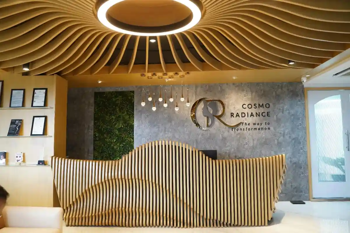 Custom parametric wooden reception desk at Cosmo Radiance clinic