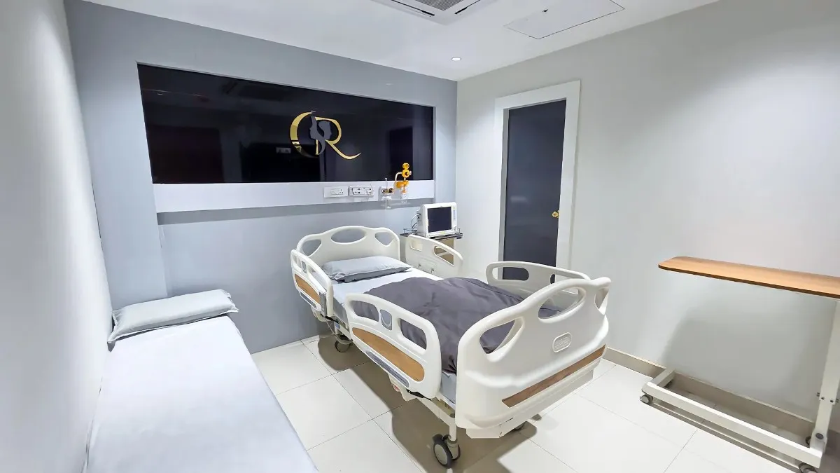 Spacious inpatient suite designed with marble decor and a dedicated attendant bed